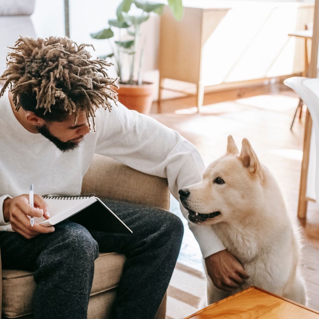 Man petting his dog