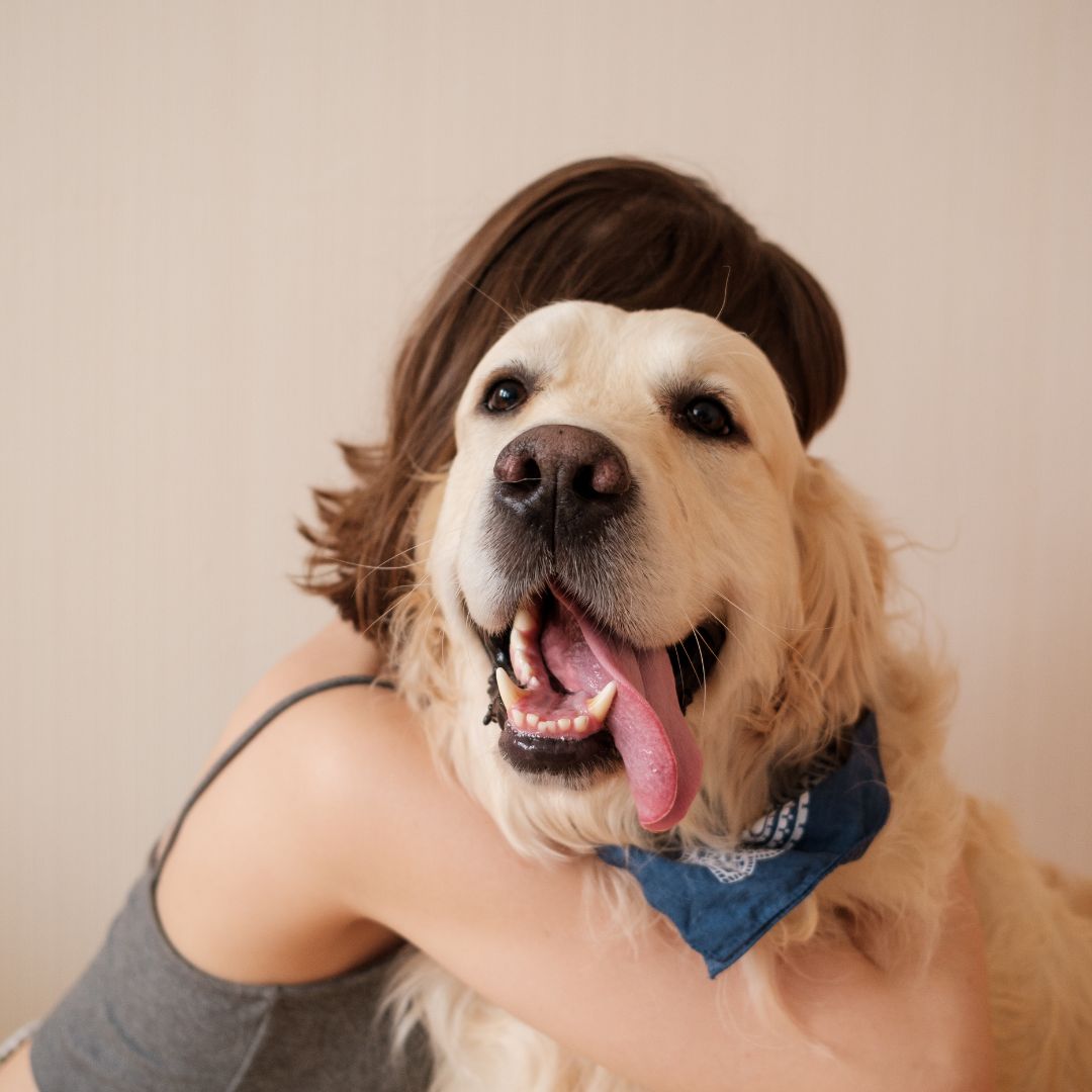 Woman hugging her dog
