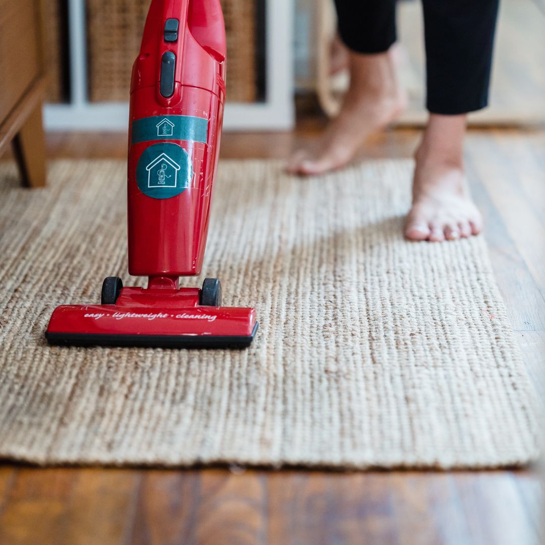 Vacuuming the home.