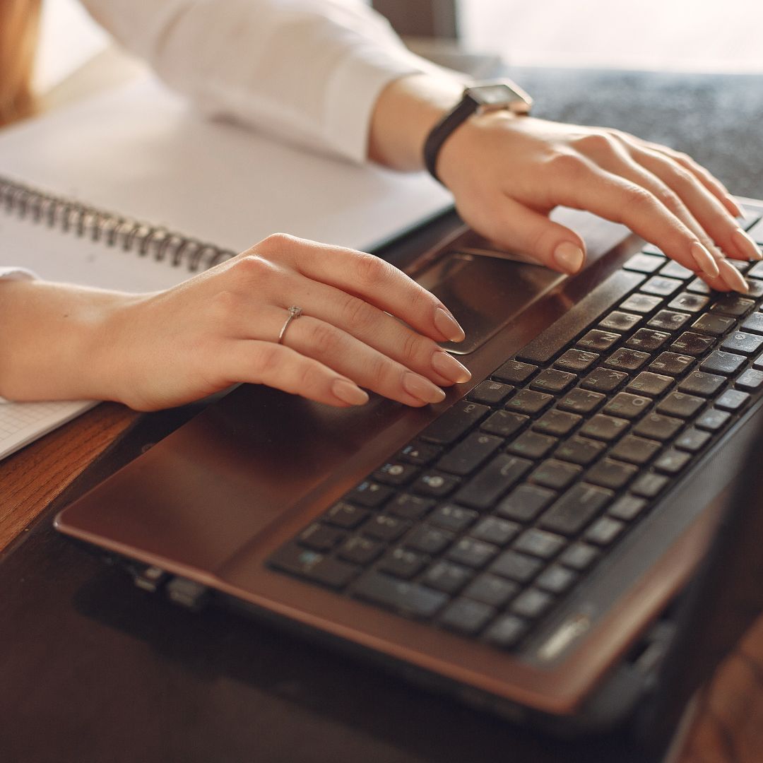 woman typing on computer